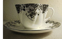 Dainty Black cup and saucer